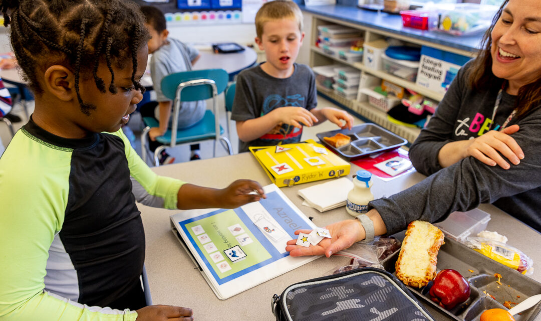 A classroom with support staff