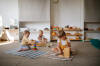 children focus on playing with eco-friendly natural toys on the floor in a bright room, - child care stock pictures, royalty-free photos & images