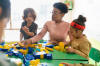 teacher playing with toy blocks in class at the school - child care stock pictures, royalty-free photos & images